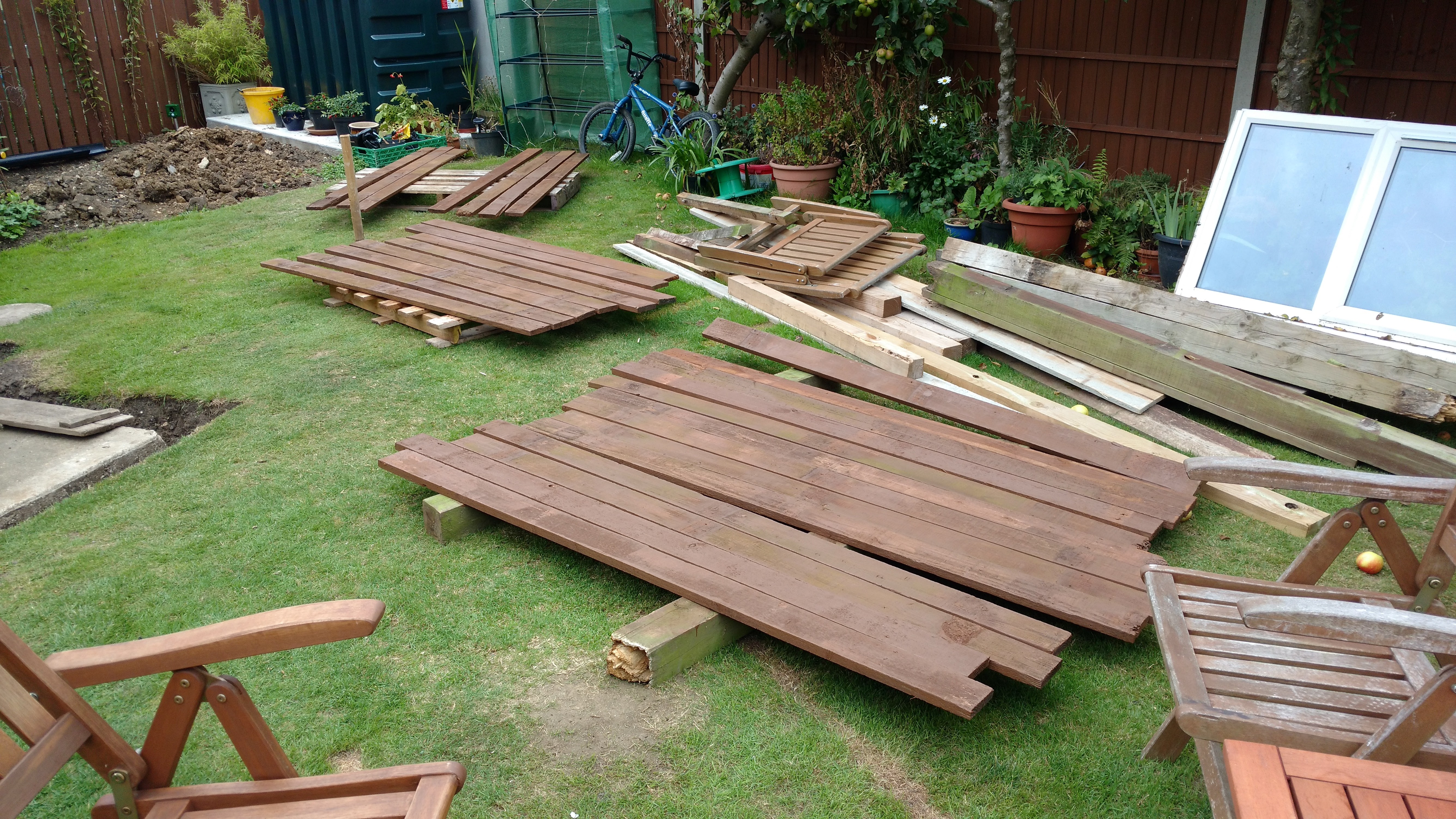 Painting the reclaimed fence panels
