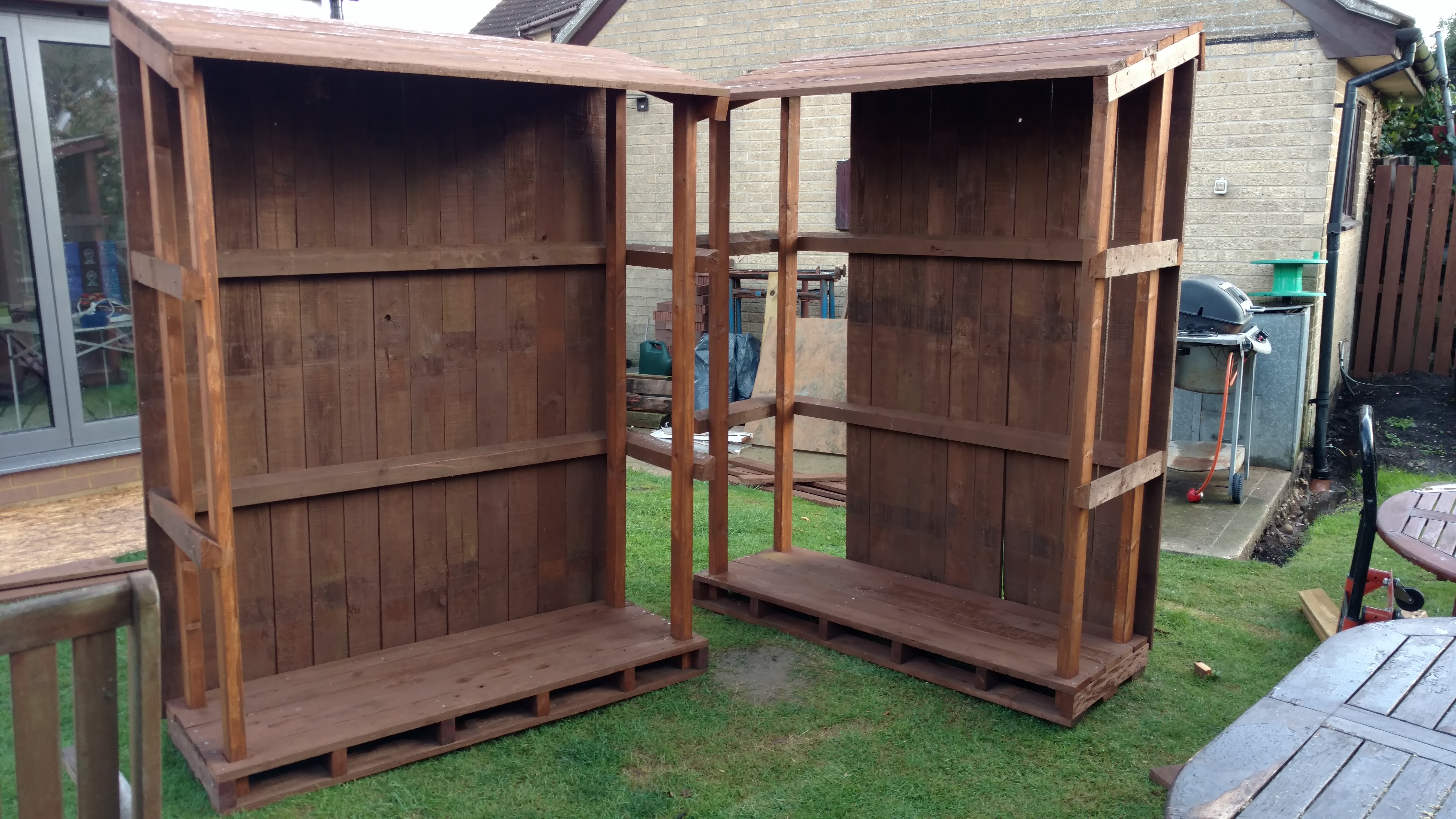 The two log stores with the back panelling