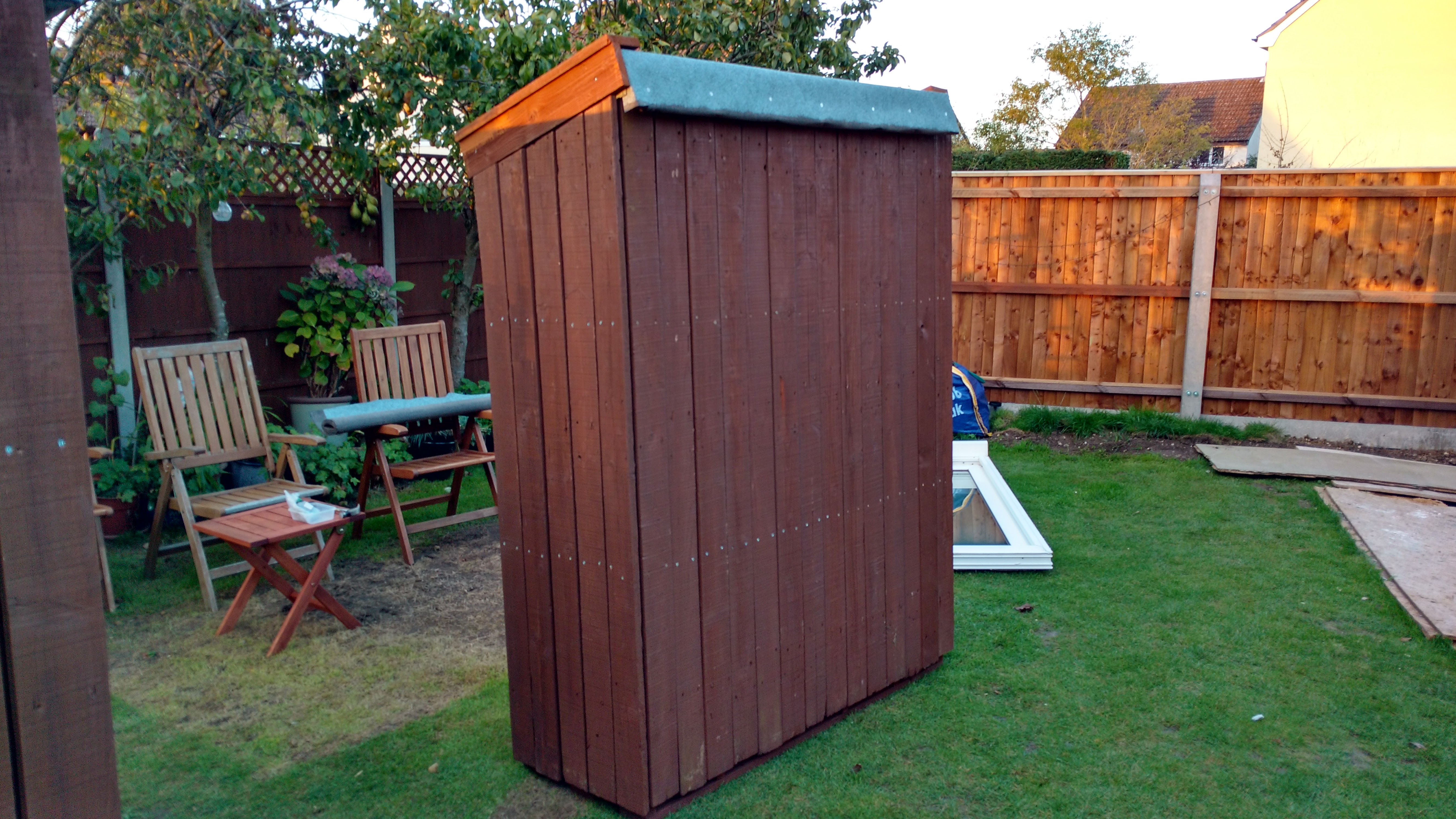 The other completed log store with a felt roof