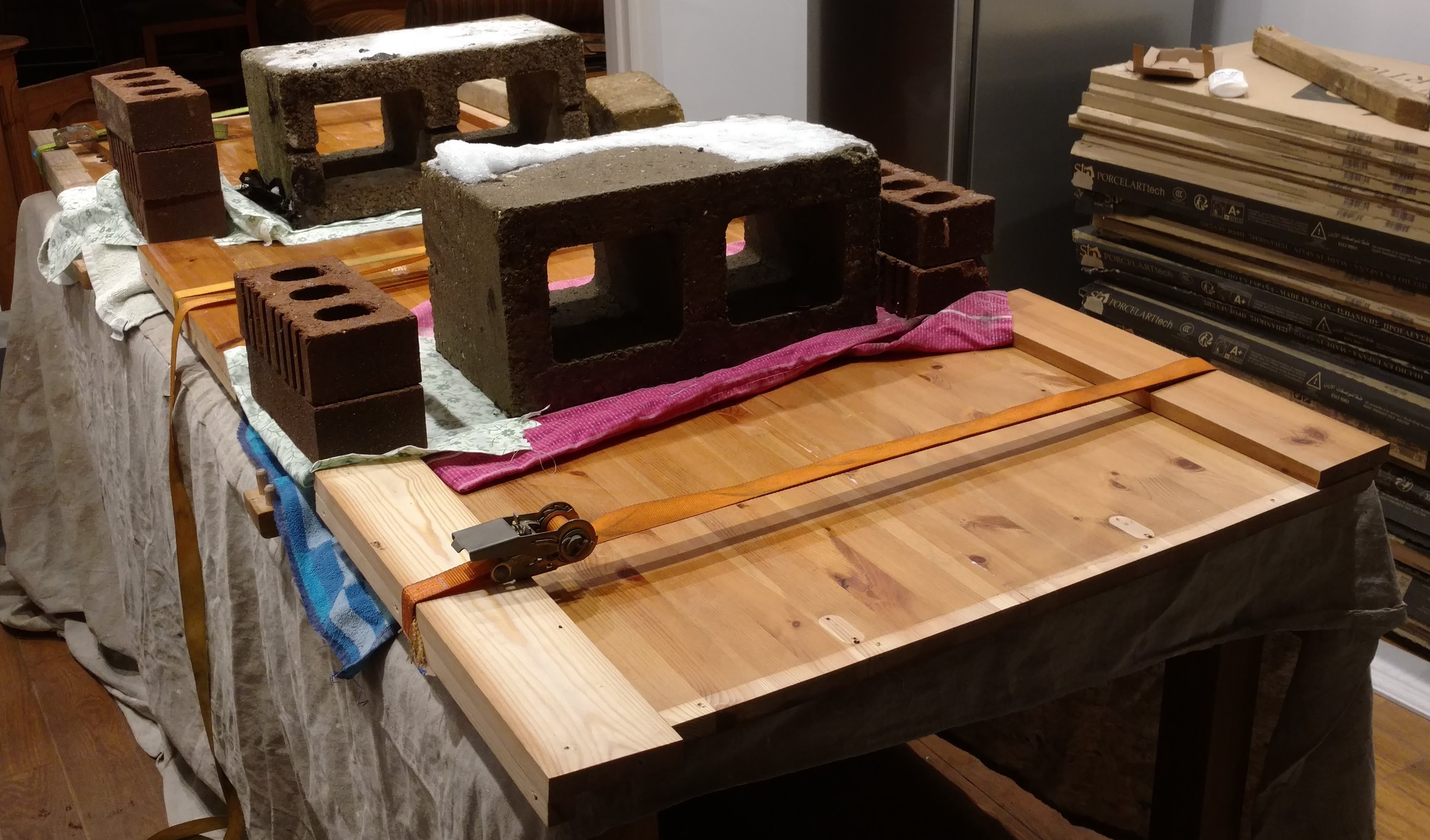 Using straps and weights to ensure the top was flat during drying