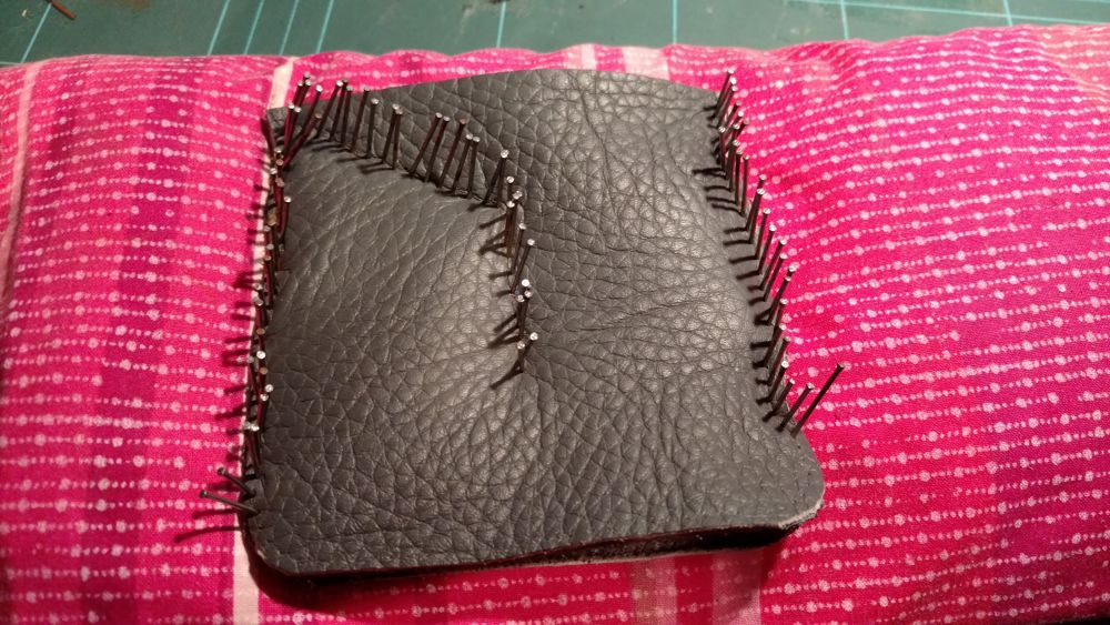 Using nails to create holes to enable the needle to pass through